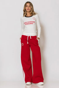 Λευκή ζέρσεϊ μπλούζα με τύπωμα logo