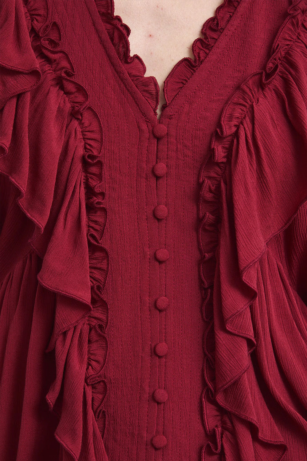 Γυναικεία μπλούζα 100% βισκόζη σε burgundy με V λαιμόκοψη και βολάν.