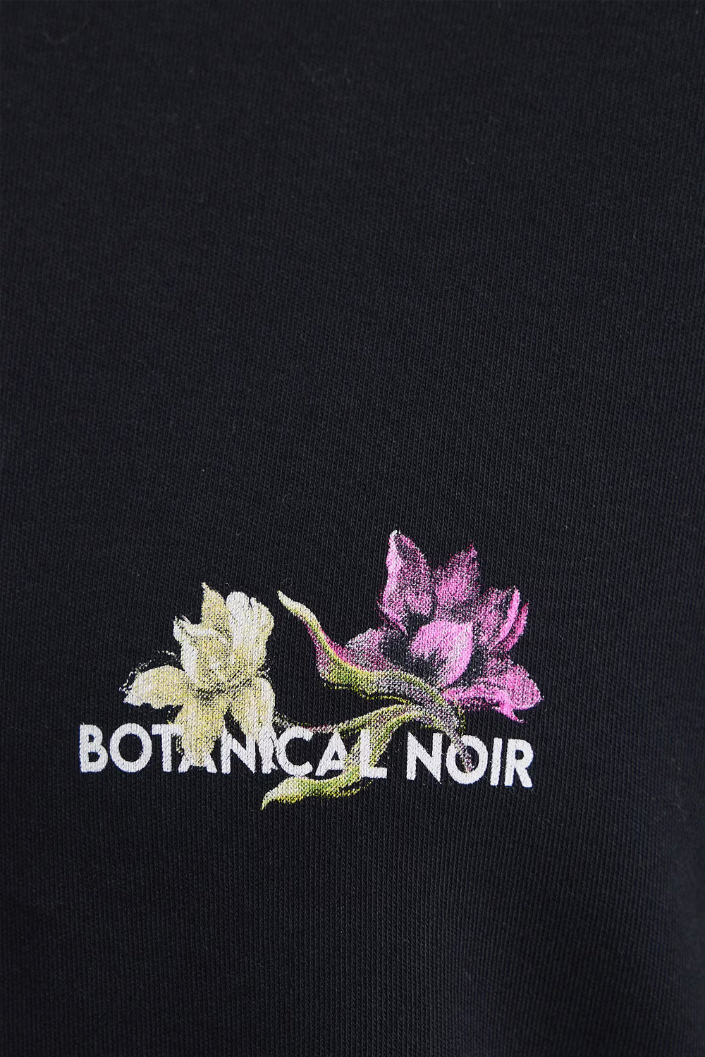 Γυναικεία μαύρη oversized βαμβακερή μπλούζα Botanical Noir με μεγάλο floral print στην πλάτη