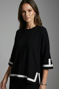 Μαύρη oversized μπλούζα με λευκή αντίθεση σε μανίκια και τελείωμα σε άνετη γραμμή