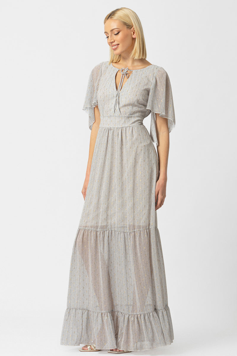 Γυναικείο maxi φόρεμα εκρού με μικρό print, δέσιμο στο λαιμό και βολάν στο τελείωμα