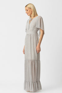 Γυναικείο maxi φόρεμα εκρού με μικρό print, δέσιμο στο λαιμό και βολάν στο τελείωμα