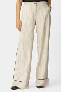 Μπεζ ριγέ γυναικεία παντελόνα σε φαρδιά γραμμή με μαύρη ρέλι στο πλάι και στο τελείωμα