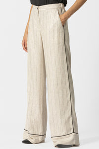 Μπεζ ριγέ γυναικεία παντελόνα σε φαρδιά γραμμή με μαύρη ρέλι στο πλάι και στο τελείωμα