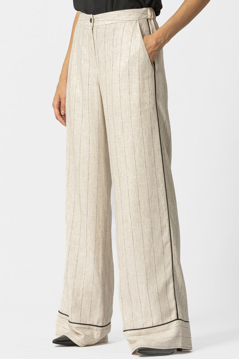 Μπεζ ριγέ γυναικεία παντελόνα σε φαρδιά γραμμή με μαύρη ρέλι στο πλάι και στο τελείωμα