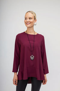 Oversized μπορντό μπλούζα με ασύμμετρο κόψιμο και βολάν στο τελείωμα – Ellisargi Boutique