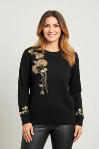 Μαύρη πλεκτή μπλούζα με χρυσά κεντήματα λουλουδιών στο στήθος και στα μανίκια