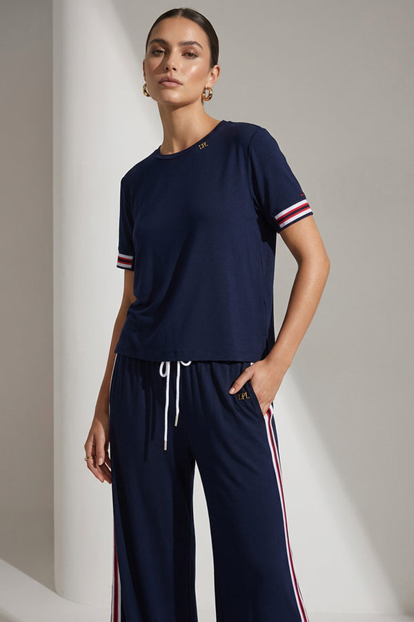 Γυναικεία navy παντελόνα με λευκό-κόκκινη πλαϊνή ρίγα και λάστιχο στη μέση.