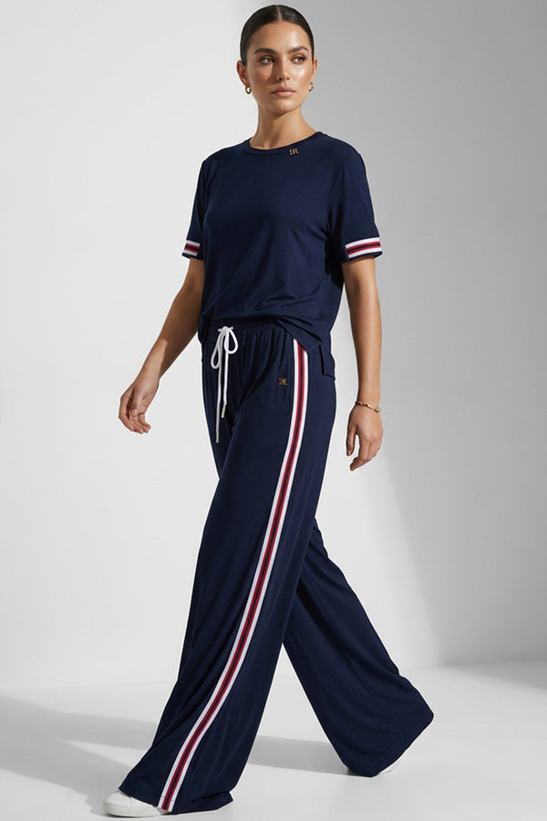 Γυναικεία navy παντελόνα με λευκό-κόκκινη πλαϊνή ρίγα και λάστιχο στη μέση.