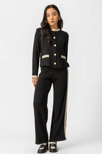 Μαύρη παντελόνα πλεκτή με λευκή φάσα στο πλάι και άνετη γραμμή