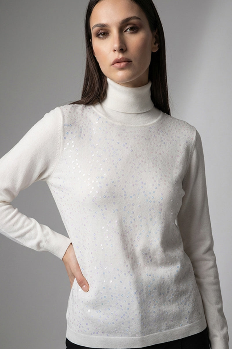 Πλεκτή μπλούζα εκρού ζιβάγκο με διακριτική παγιέτα στο μπροστινό μέρος και μακριά μανίκια, σε κομψή άνετη γραμμή.