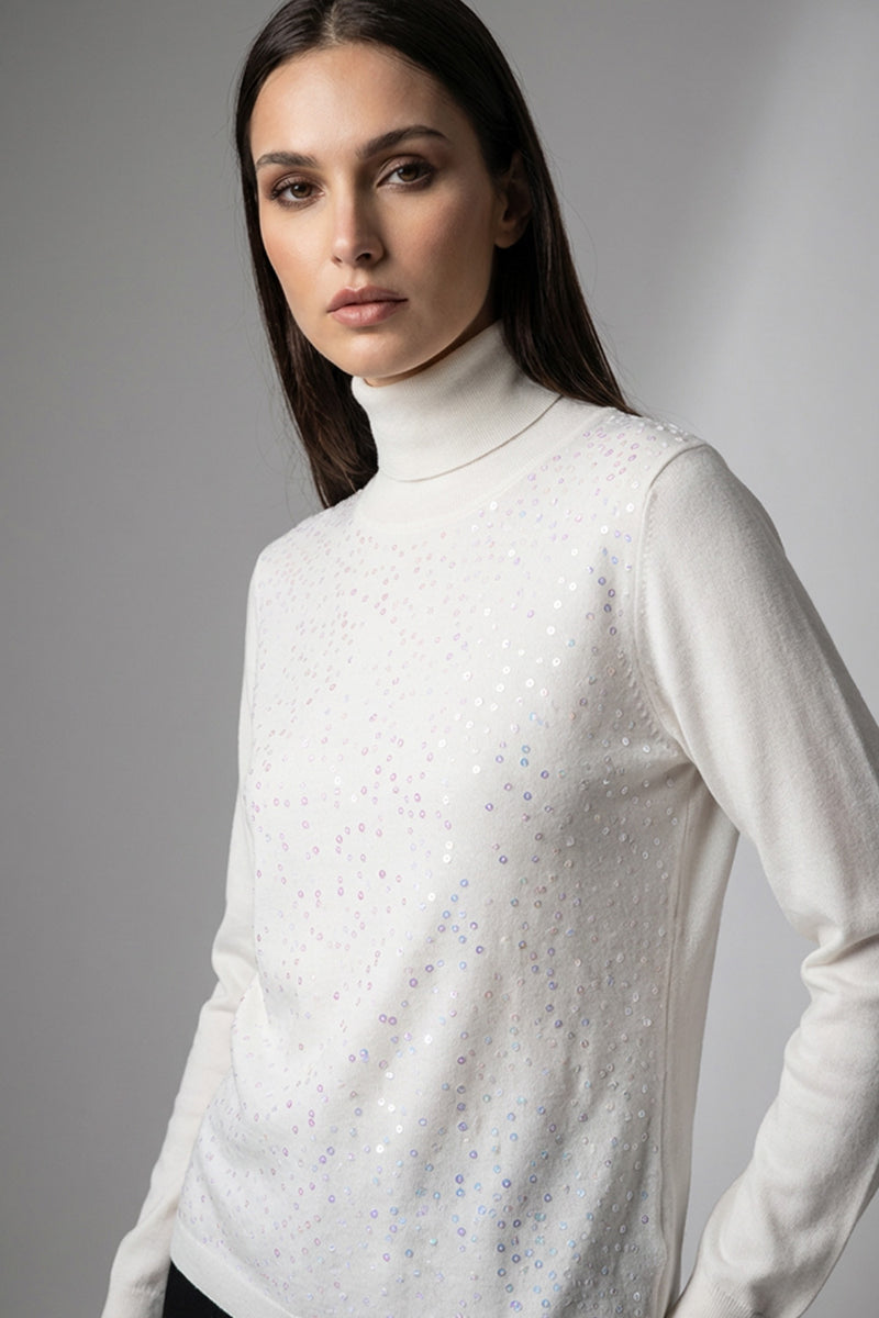 Πλεκτή μπλούζα εκρού ζιβάγκο με διακριτική παγιέτα στο μπροστινό μέρος και μακριά μανίκια, σε κομψή άνετη γραμμή.