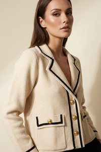 Πλεκτή ζακέτα εκρού με μαύρο τελείωμα και χρυσά κουμπιά