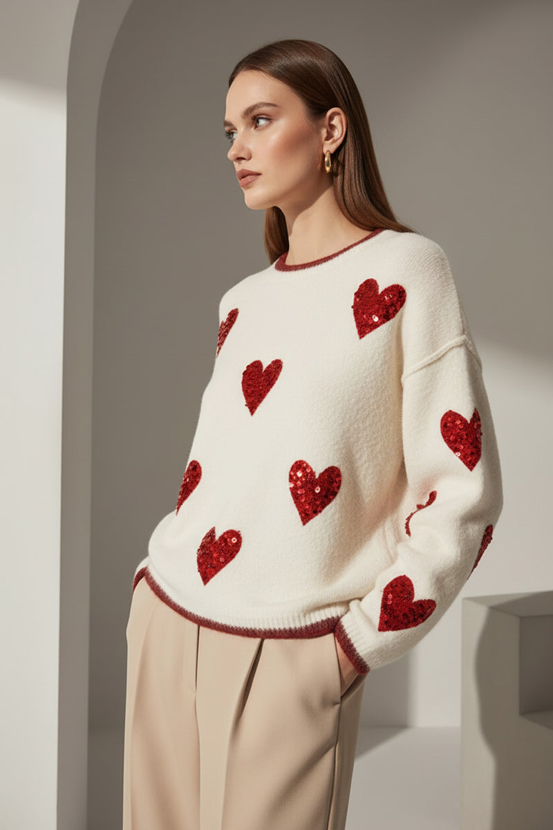 Πουλόβερ κρεμ με κόκκινες καρδιές παγιέτα σε άνετη γραμμή One Size μοντέλο Ellisargi Boutique