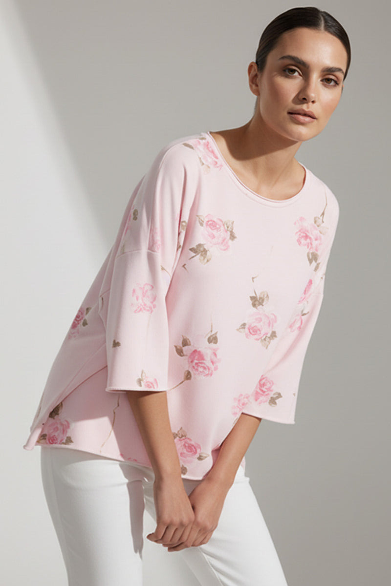 Ροζ γυναικεία μπλούζα με floral τύπωμα και 3/4 φαρδιά μανίκια σε χαλαρή γραμμή.