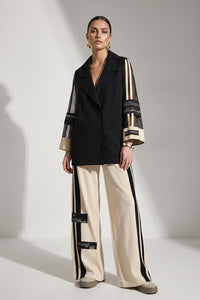 Γυναικείο σετ με μαύρο διπλόκουμπο σακάκι με διαφανή μανίκια και μπεζ παντελόνα με μαύρες ρίγες στο πλάι